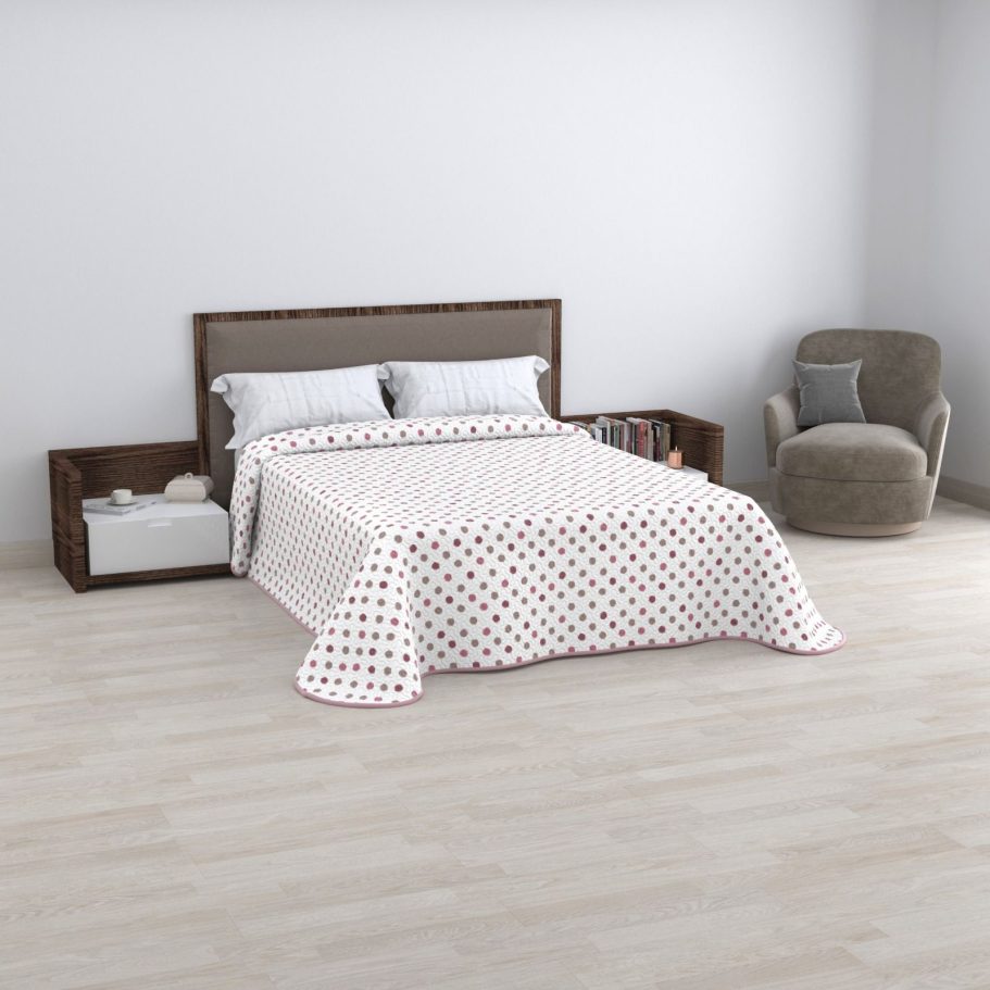 Eco bouti Bea Cama con colcha de cuadros rojos y blancos, sillón gris y estantería en un ambiente minimalista.